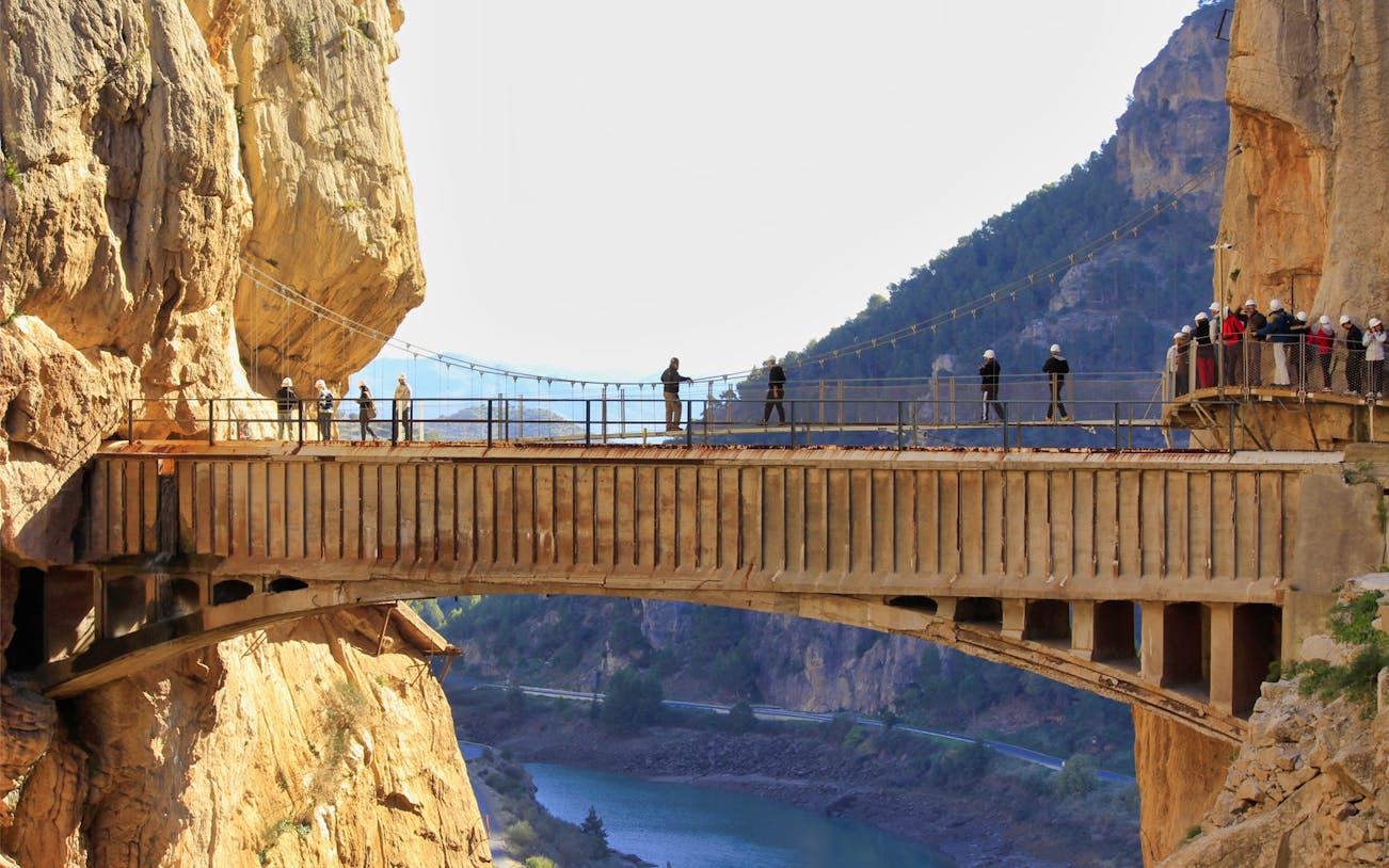 Visitors walking on Caminito del Rey bridge in Ardales, Spain.