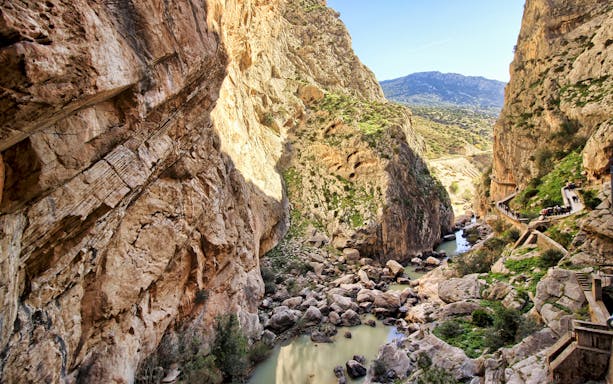 Caminito del Rey pathway winding through rocky gorge in Ardales.