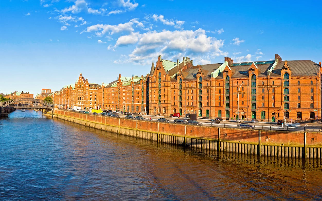 Speicherstadt district in Hamburg with historic red brick warehouses along the canal.