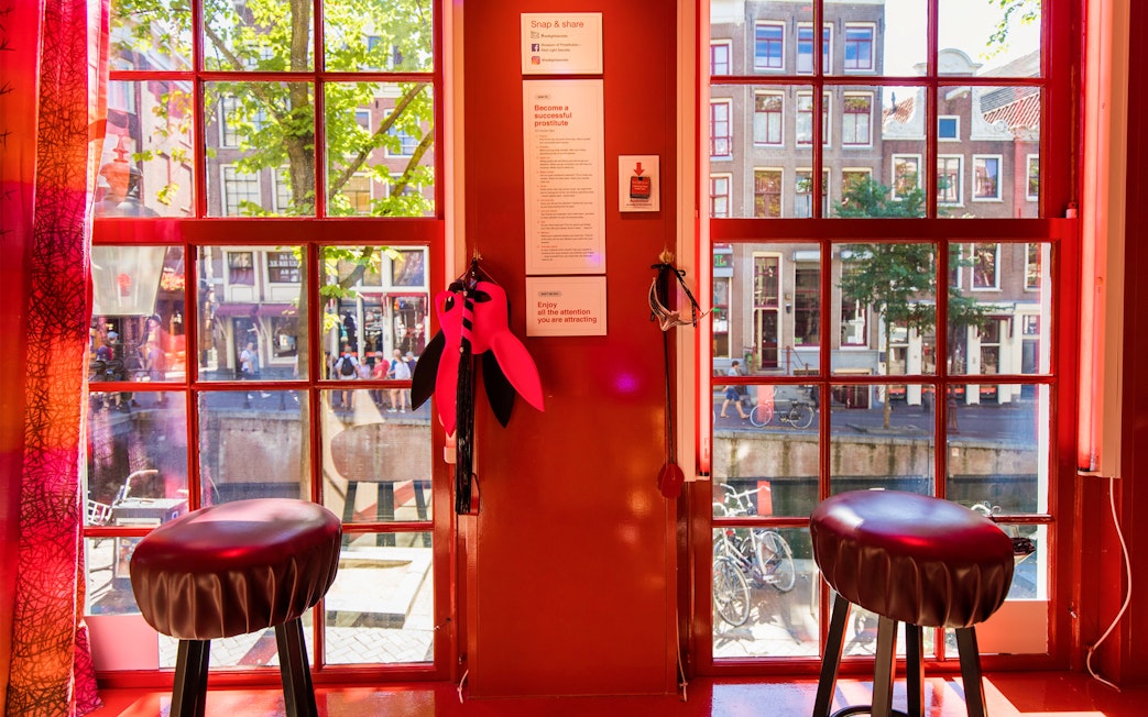 Interior view of Red Light Secrets Museum of Prostitution with window overlooking Amsterdam street.