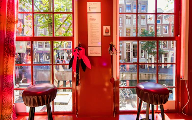 Interior view of Red Light Secrets Museum of Prostitution with window overlooking Amsterdam street.