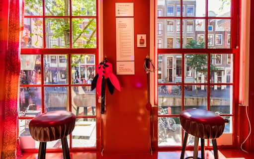 Interior view of Red Light Secrets Museum of Prostitution with window overlooking Amsterdam street.