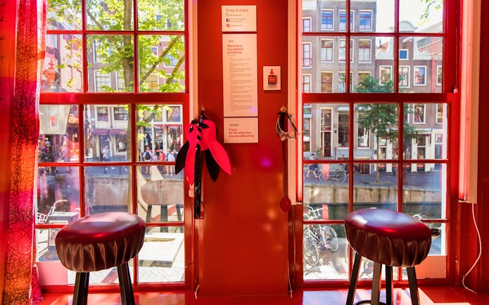 Interior view of Red Light Secrets Museum of Prostitution with window overlooking Amsterdam street.