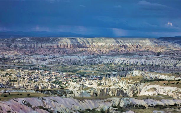 Cappadocia landscape with rock formations and town, North Cappadocia Day Tour.