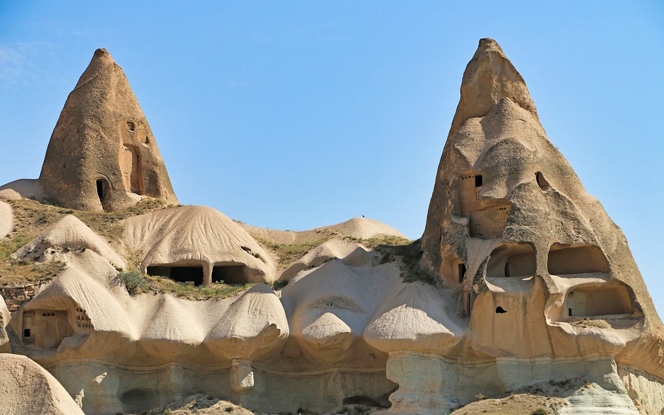 Rock formations with carved dwellings in North Cappadocia, Turkey.