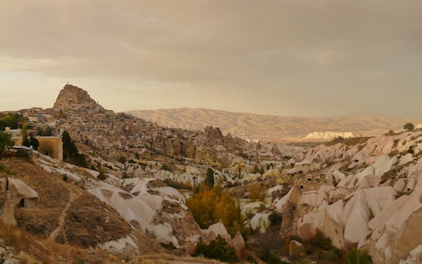 Cappadocia landscape with rock formations and ancient dwellings on South Cappadocia Day Tour.