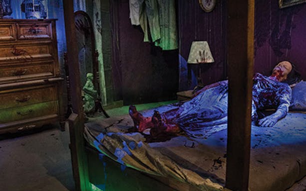 Haunted bedroom scene at Hysteria Haunted Attraction, Dubai Mall.