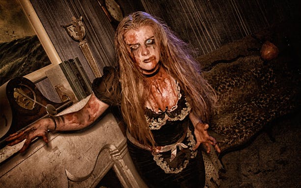 Haunted house actor in costume at Hysteria Haunted Attraction, Dubai Mall.