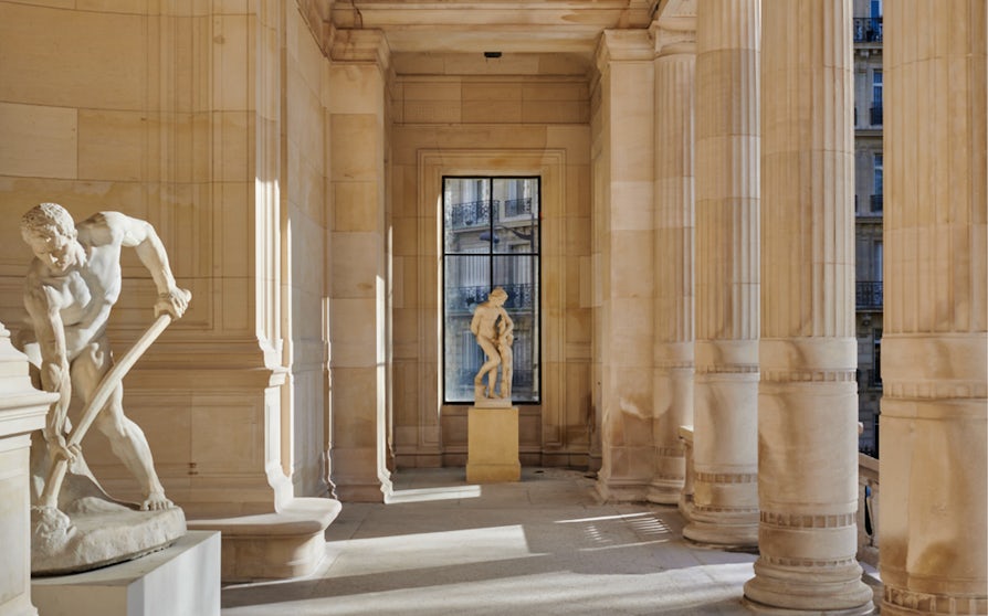 Statues and columns inside Palais Galliera, Paris, at Gabrielle Chanel Fashion Manifesto Exhibition.