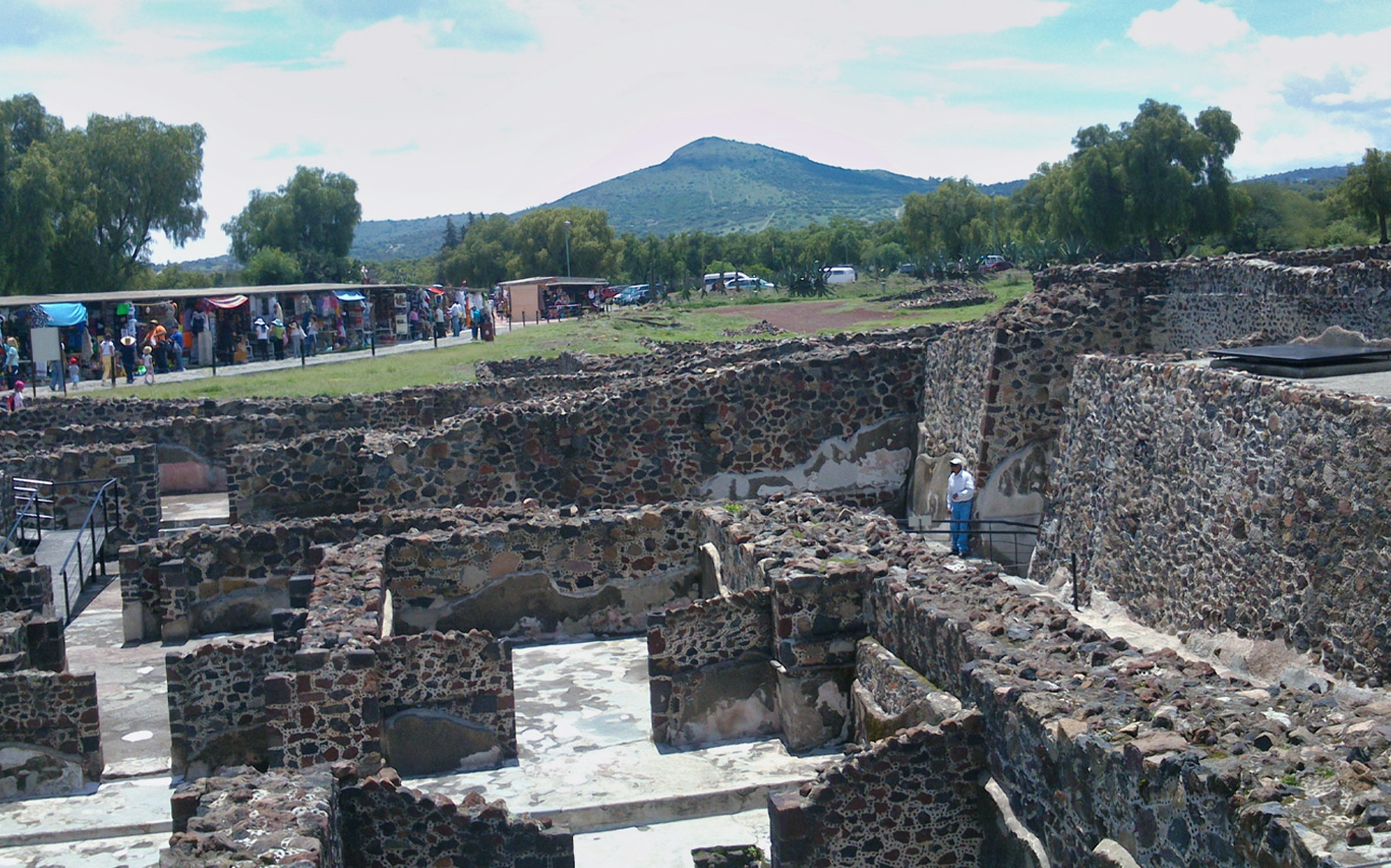 Teotihuacan pyramids with tourists exploring, Tlatelolco ruins, and Guadalupe Shrine in Mexico City tour.