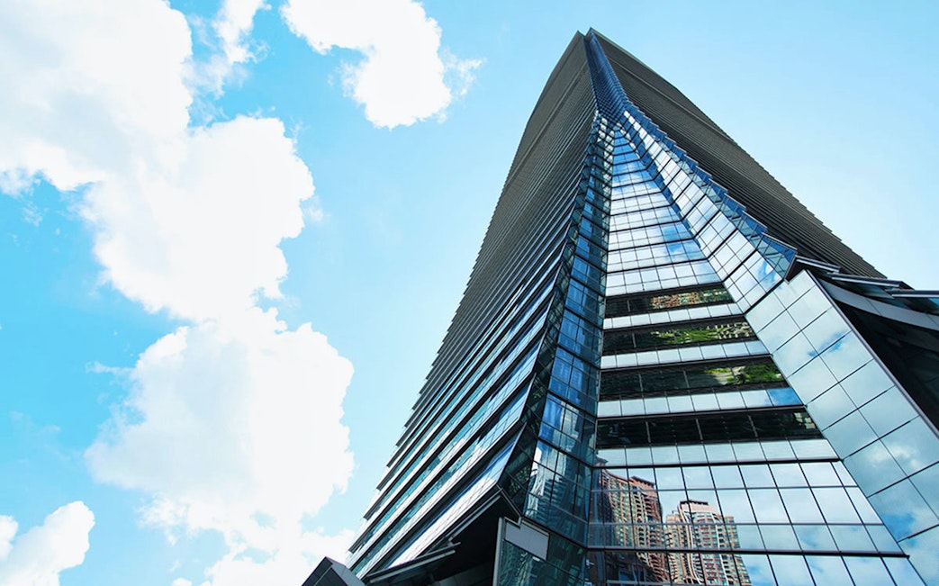 Sky100 observation deck exterior in Hong Kong under blue sky.