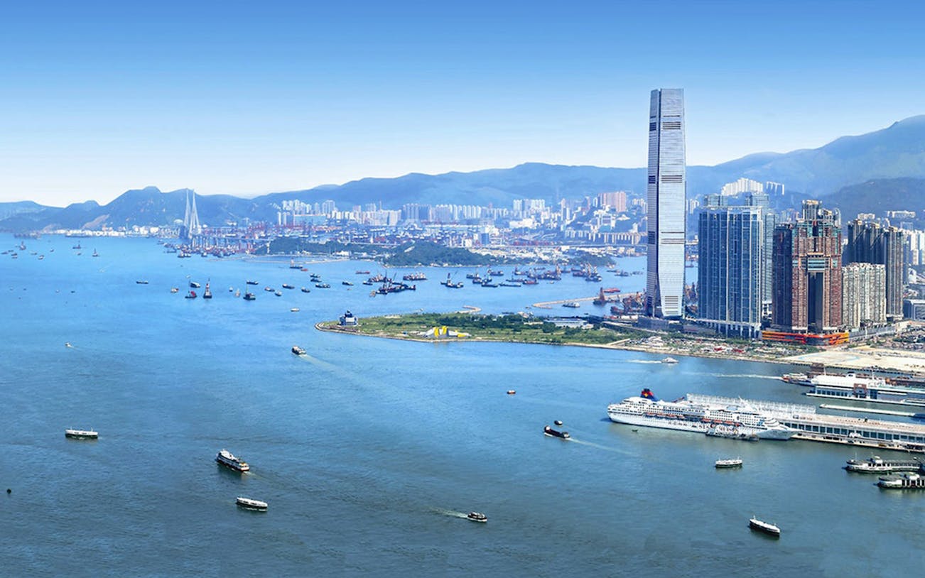 Skyline view of Hong Kong with ICC tower near Sky100, overlooking Victoria Harbour.
