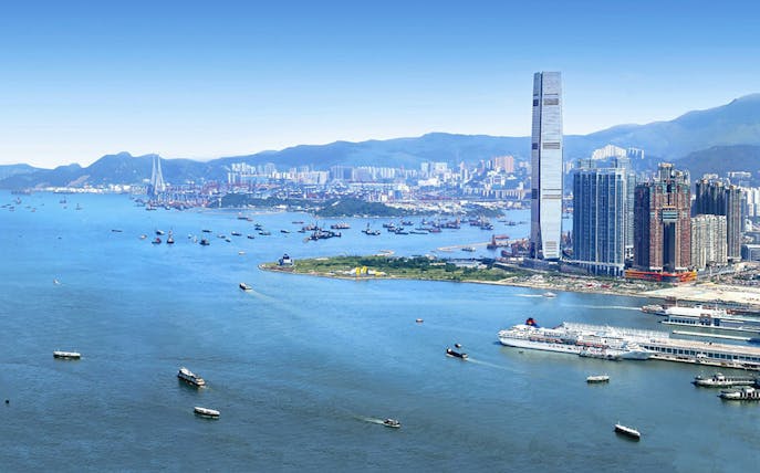 Skyline view of Hong Kong with ICC tower near Sky100, overlooking Victoria Harbour.