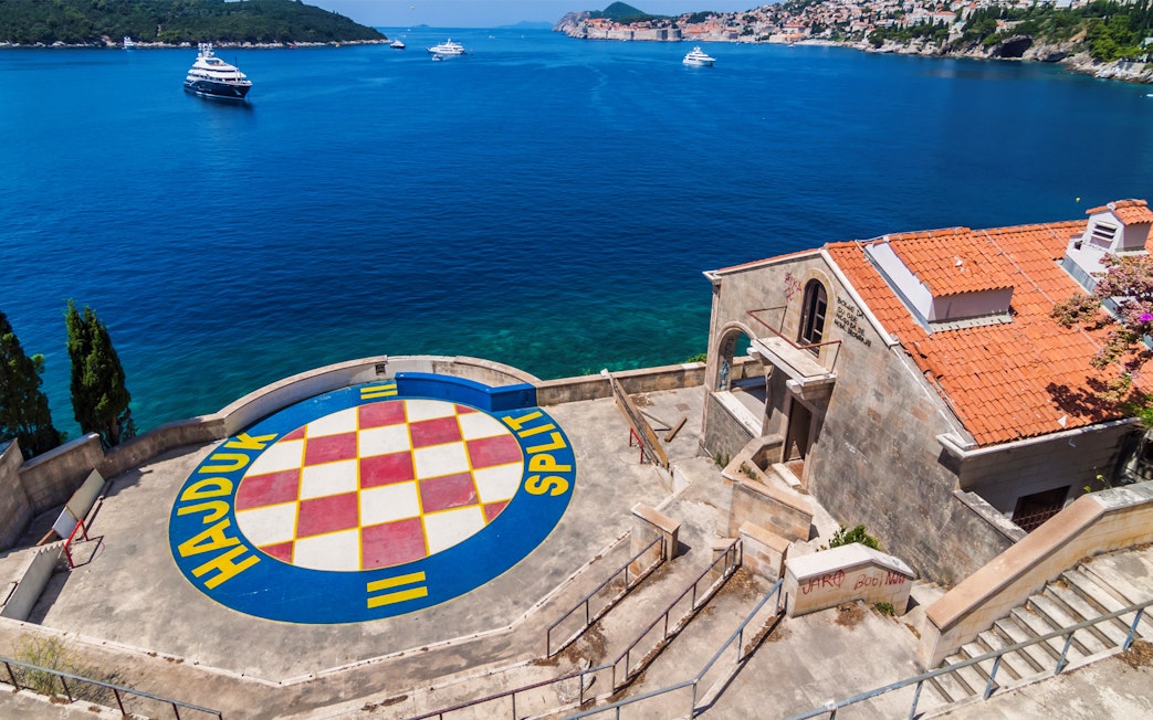 Dubrovnik coastline with Hajduk Split logo, part of Game of Thrones driving tour.
