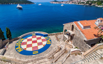 Dubrovnik coastline with Hajduk Split logo, part of Game of Thrones driving tour.