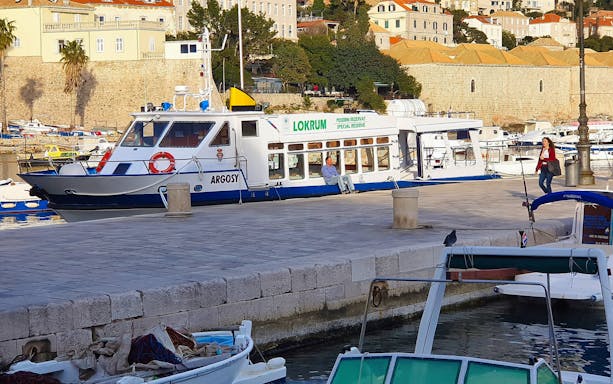 Boat docked in Dubrovnik harbor for Game of Thrones tour.