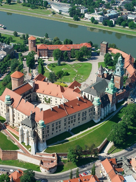 Aerial view of Wawel Royal Castle on Wawel Hill, Kraków, Poland, surrounded by the Vistula River.