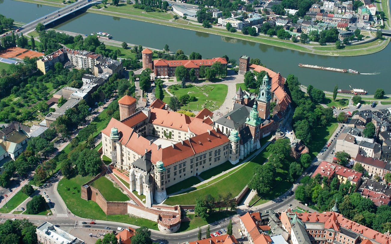 Aerial view of Wawel Royal Castle on Wawel Hill, Kraków, Poland, surrounded by the Vistula River.