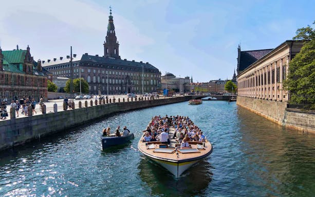 Boat tour on Copenhagen canal near Christiansborg Palace.
