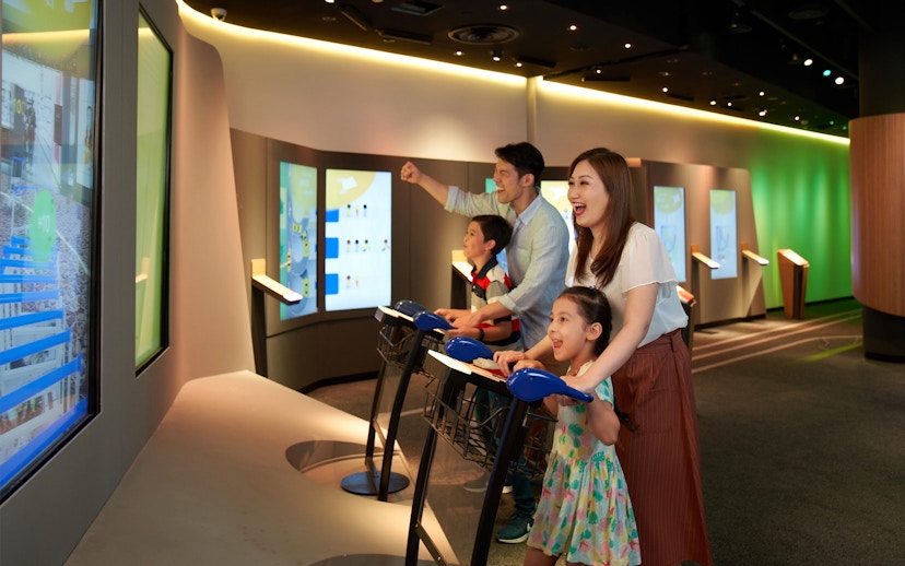 Family enjoying interactive games at Changi Experience Studio, Singapore.