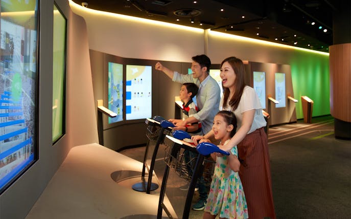 Family enjoying interactive games at Changi Experience Studio, Singapore.