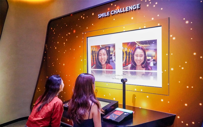 Visitors participating in the Smile Challenge at Changi Experience Studio.