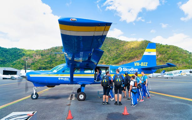 Skydivers boarding a plane for a 15,000ft tandem skydive in Cairns, Australia.