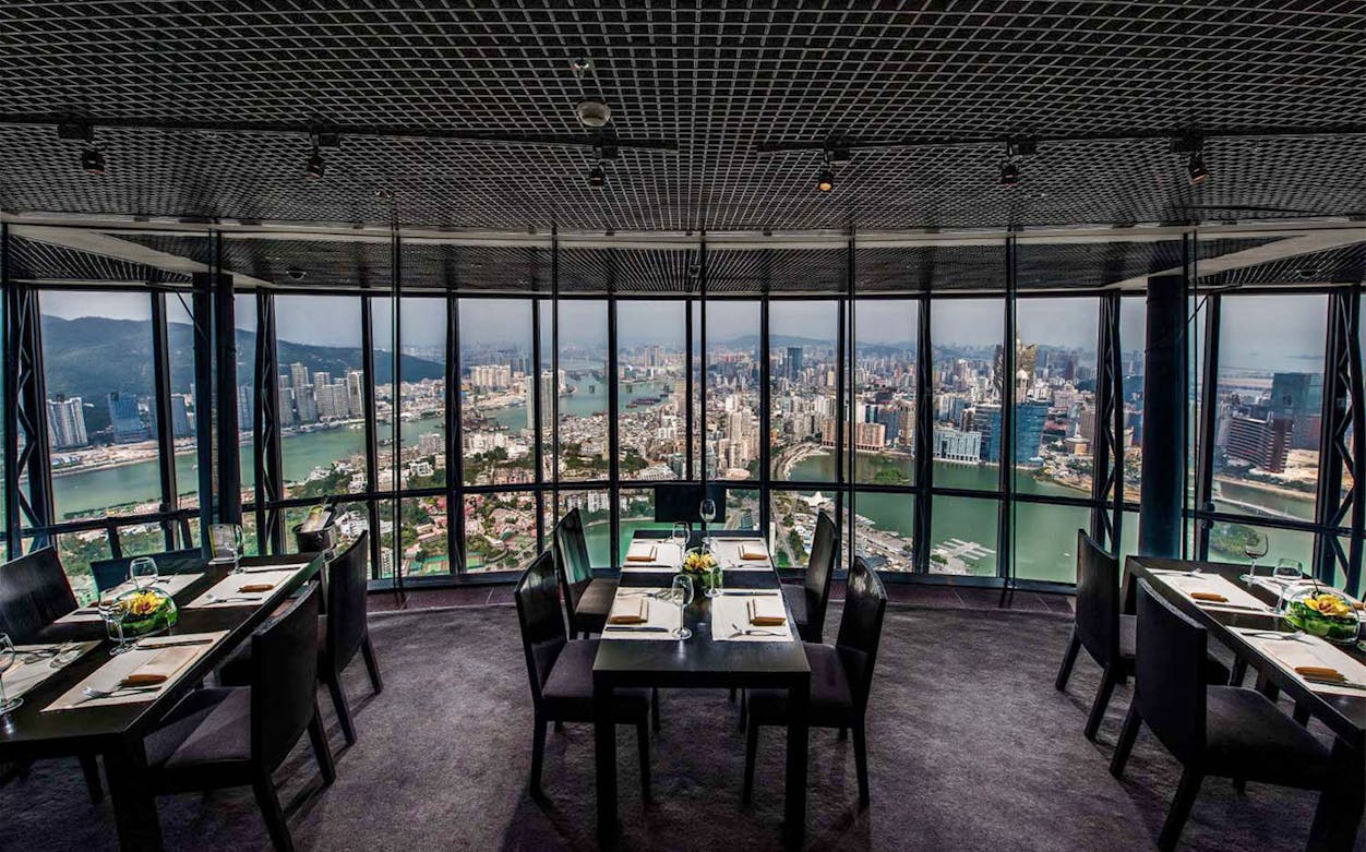 Dining tables with city view at 360 Cafe, Macau Tower.