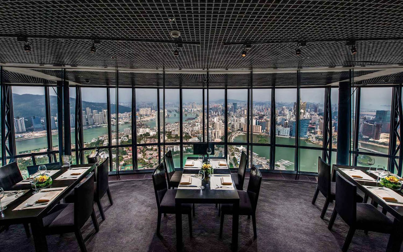 Dining tables with city view at 360 Cafe, Macau Tower.