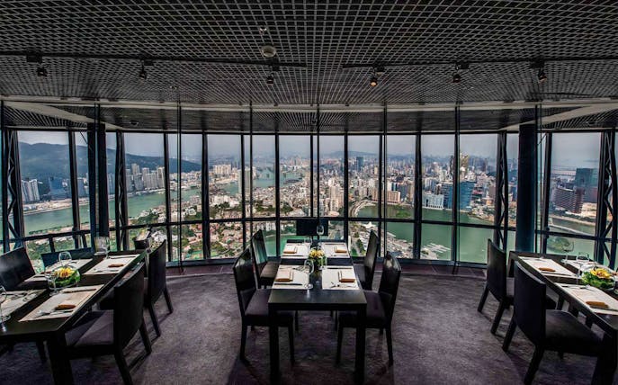 Dining tables with city view at 360 Cafe, Macau Tower.