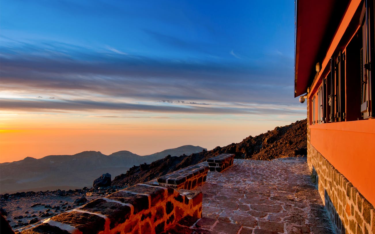 Mount Teide sunset view with stone path and building, Tenerife.