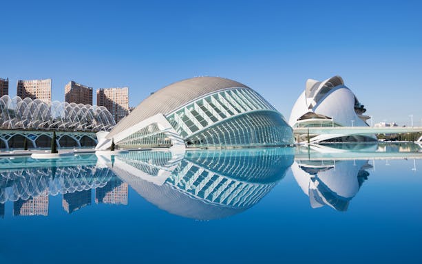 Hemispheric building reflecting in water at City of Arts and Sciences, Valencia.