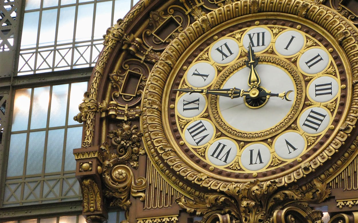 Ornate clock inside Orsay Museum, Paris, part of the Tickets to Orsay Museum & Seine River Cruise tour.