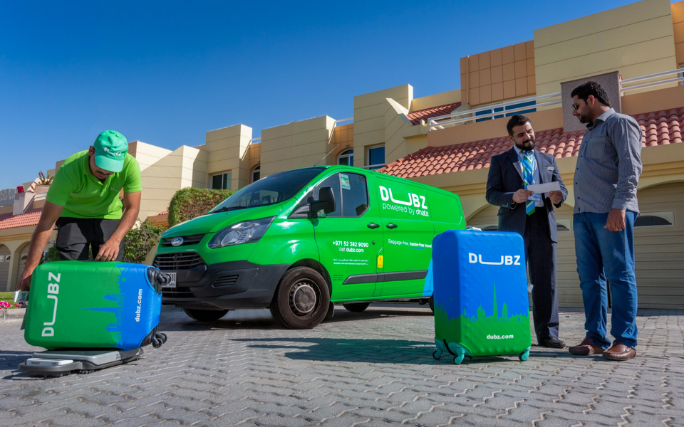 DUBZ home check-in service with staff assisting customer outside residence