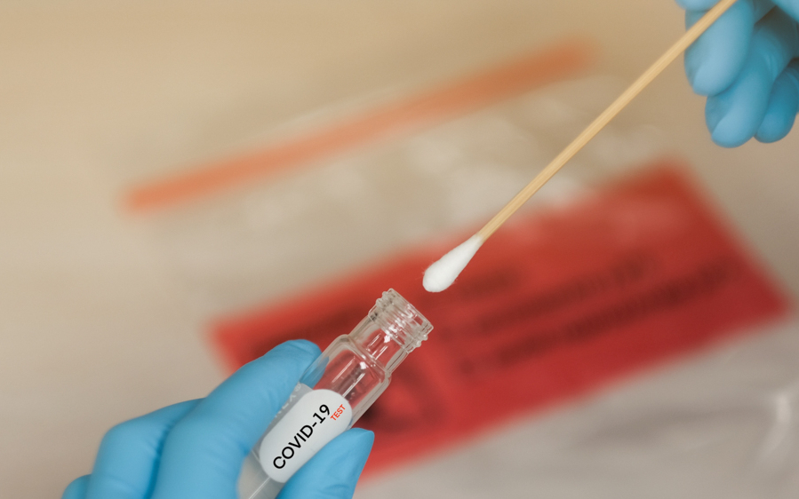 COVID-19 PCR test swab and vial for DUBZ home testing service.