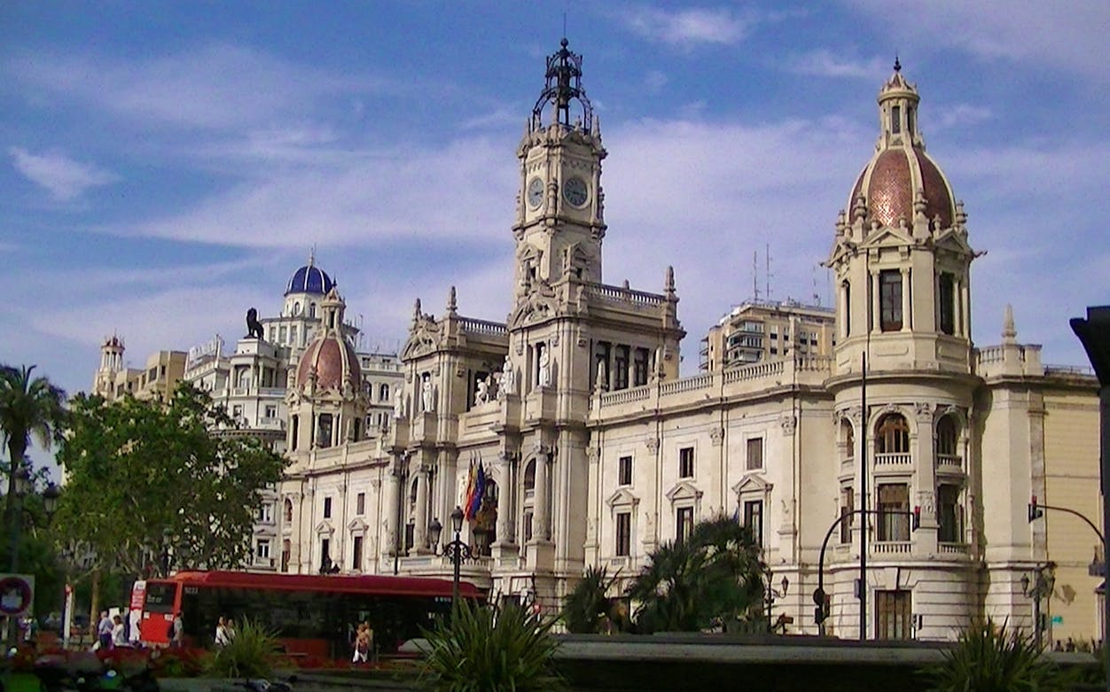 Valencia City Hall with red bus in front, part of Valencia Old Town Tour.