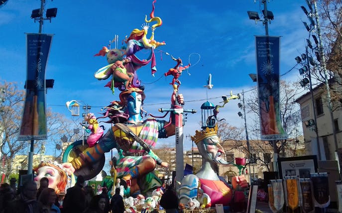 Colorful Fallas sculptures in Valencia Old Town during festival.