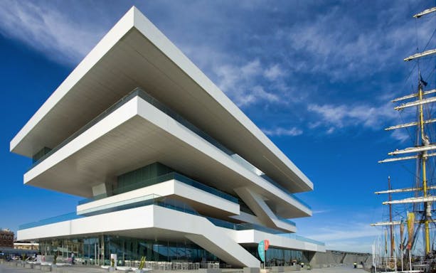 Valencia's modernist building at City of Arts and Sciences with a ship nearby.