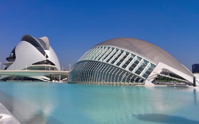 Valencia City of Arts and Sciences buildings with clear blue sky.