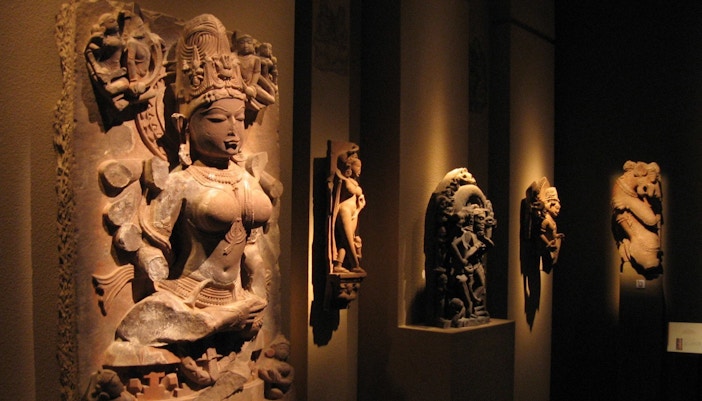 Asian Civilisations Museum entrance in Singapore with visitors exploring exhibits.