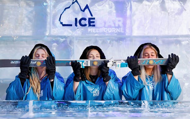 Visitors enjoying drinks at IceBar Melbourne, part of the Melbourne Skydeck and IceBar combo tour.
