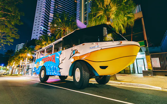 Aquaduck amphibious vehicle parked on a Gold Coast street at night.