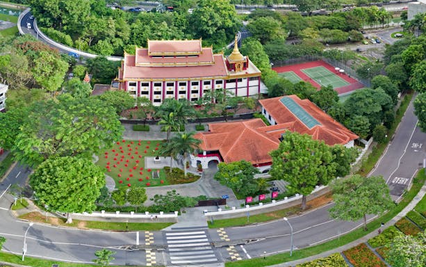 Aerial view of Sun Yat Sen Nanyang Memorial Hall with surrounding gardens and tennis courts in Singapore.