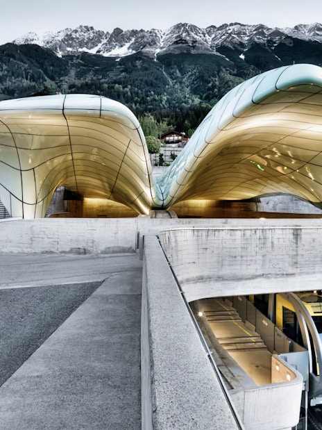 Hungerburgbahn funicular station with modern architecture and mountain backdrop in Innsbruck.
