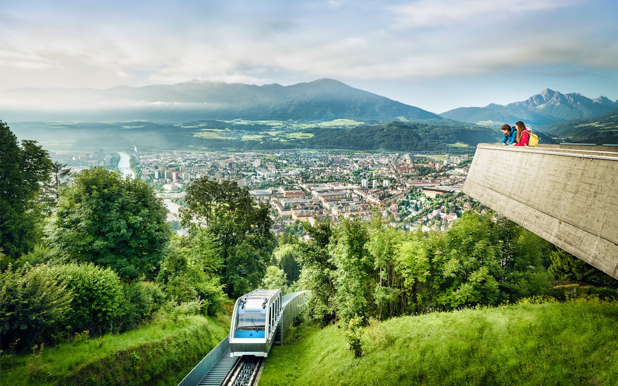 Funicular ascending to Hungerburgbahn with panoramic view of Innsbruck, Austria.