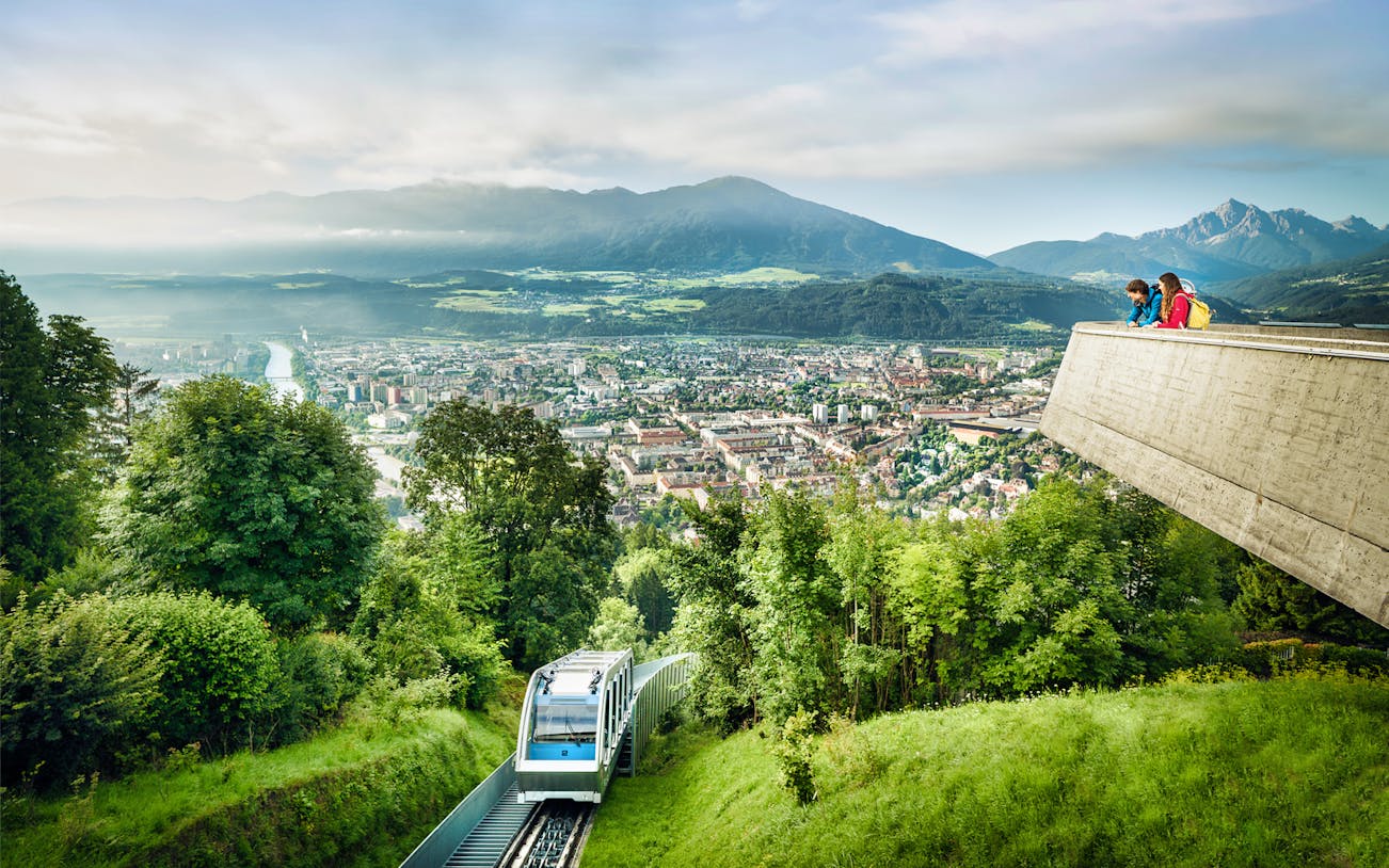 Funicular ascending to Hungerburgbahn with panoramic view of Innsbruck, Austria.