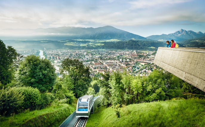Funicular ascending to Hungerburgbahn with panoramic view of Innsbruck, Austria.
