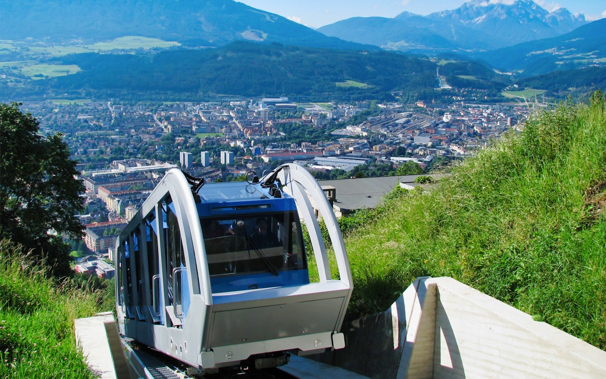 Funicular ascending to Hungerburgbahn with Innsbruck city view.