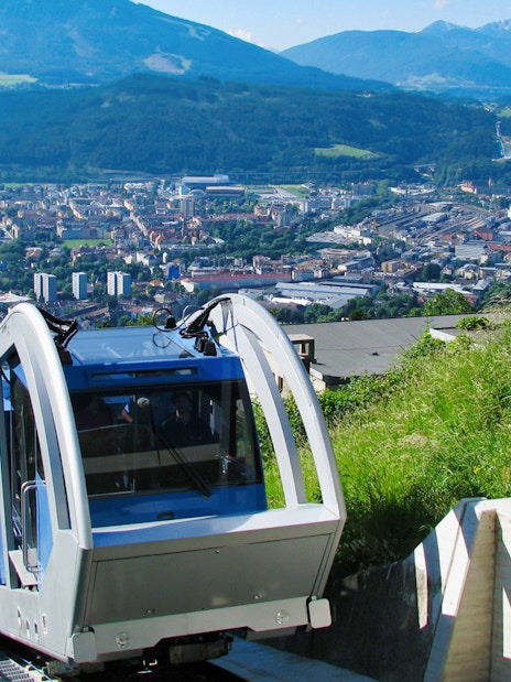 Funicular ascending to Hungerburgbahn with Innsbruck city view.