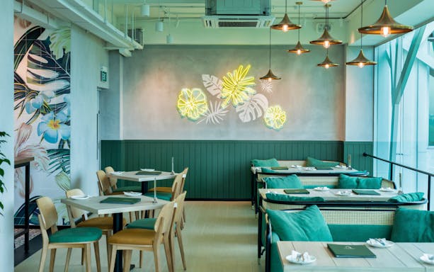 Modern dining area with tropical decor at Sentosa or Mount Faber.